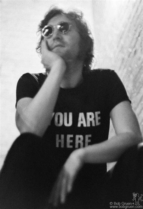 John Lennon in 'You Are Here' t-shirt on the steps at Fillmore East ...