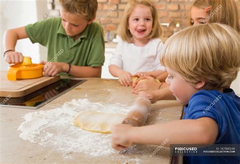 Four kids baking cookies — fun, preparation - Stock Photo | #167890248