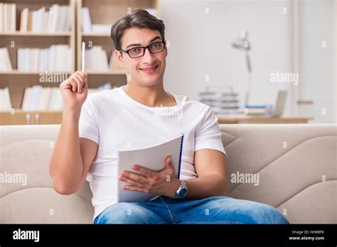 Man working sitting in couch sofa Stock Photo - Alamy