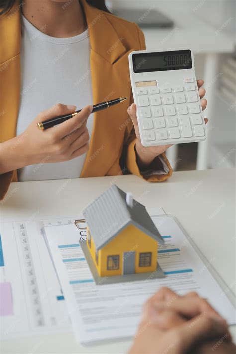 Real estate brokerage agent deliver a sample of a model house to the