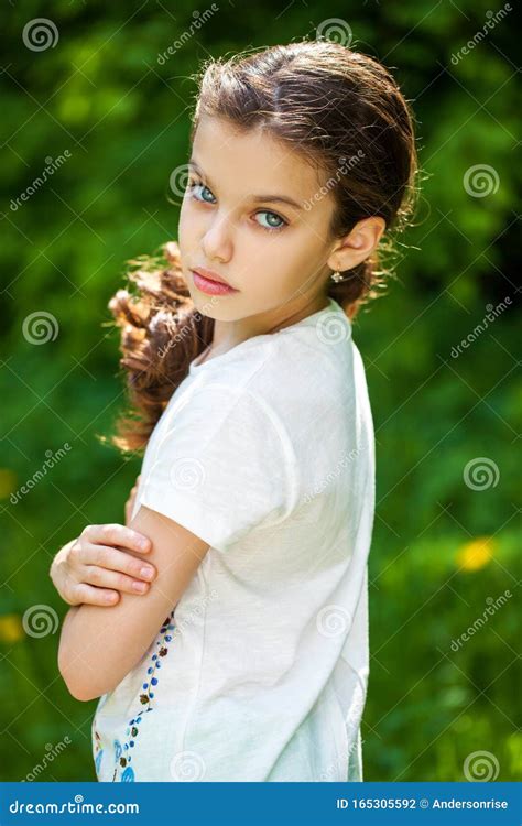 Calm Brunette Little Girl in Summer Park Stock Photo - Image of model, human: 165305592