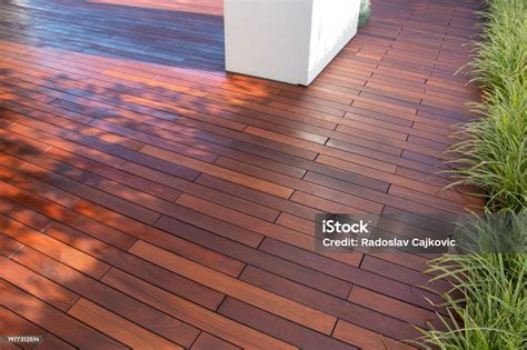 Ipe Hardwood Deck Boards Patio Idea With Evergreen Grass On Side Of ...