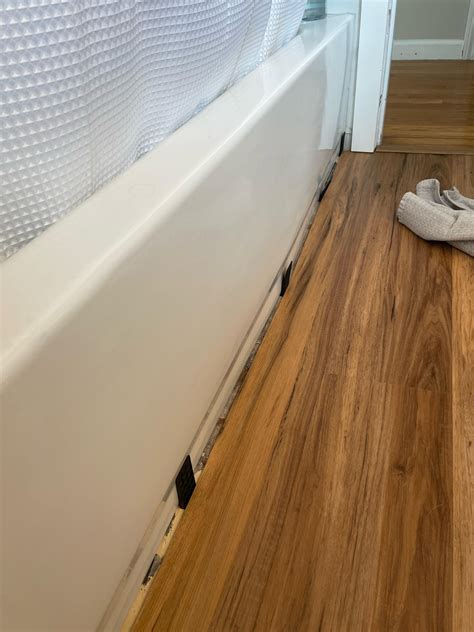 How to waterproof/seal spacer gap along tub without compromising the