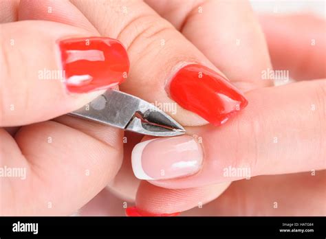 Cuticles cutting with nail clippers Stock Photo - Alamy