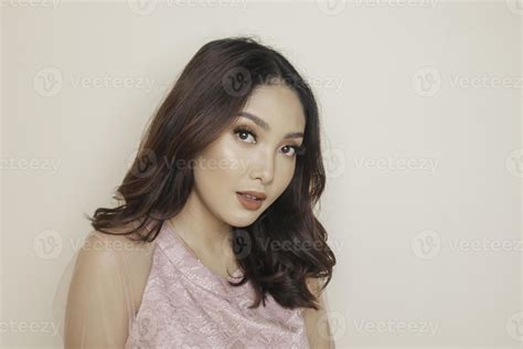 Close-up beauty face of Asian young model touching clean skin. Natural