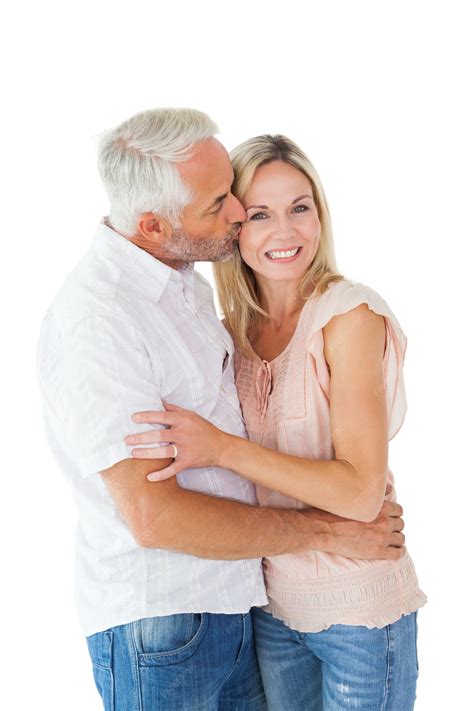 Premium Photo | Affectionate man kissing his wife on the cheek