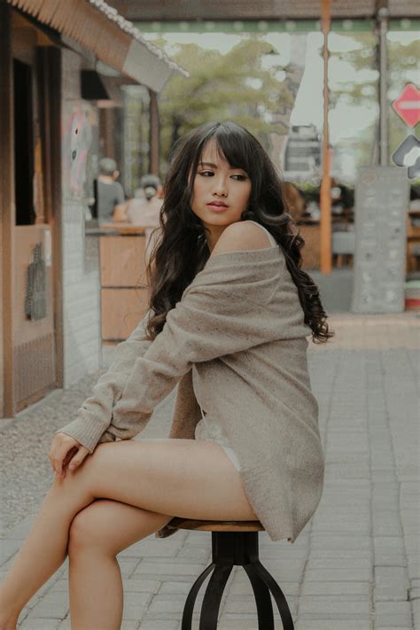Feminine Asian woman lying on comfy bed · Free Stock Photo