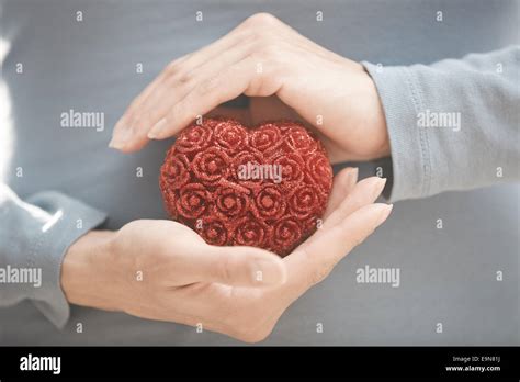 Hands with heart Stock Photo - Alamy