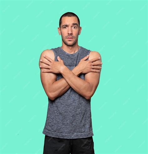 premium photo concerned young man making  gesture   cold