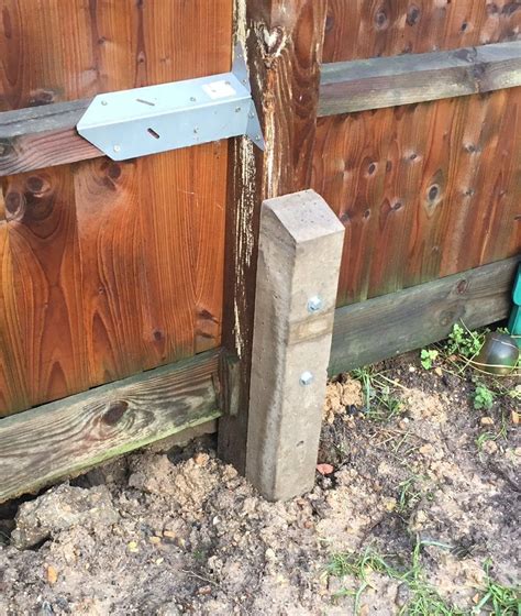 broken fence post easy long term repair rotted fence post replaced