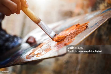 Artist Hand With Brush Painting High-Res Stock Photo - Getty Images