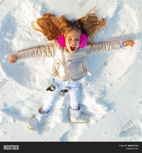 Girl On Snow Angel Image & Photo (Free Trial) | Bigstock