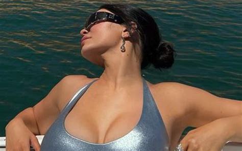 Kylie Jenner Catches Some Sun In Tight Silver One-Piece Swimsuit Photo Drop