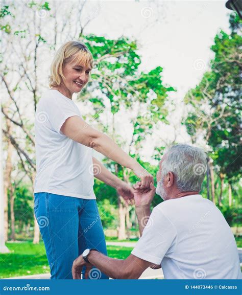 Happy Old Man Kiss His Wife Hand at the Park Stock Photo - Image of