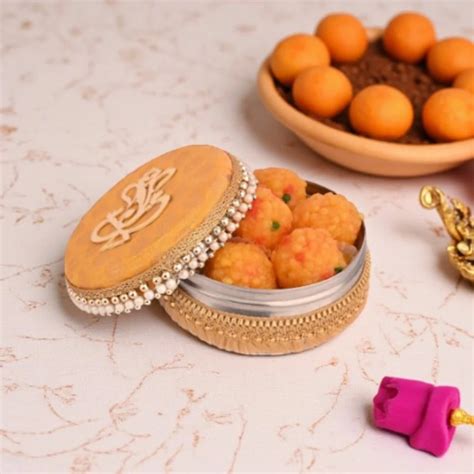 yellow ganpati handcraft laddu box  rs piece painted boxes