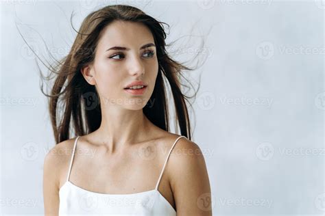 Portrait of beautiful woman with pretty face and naked shoulders