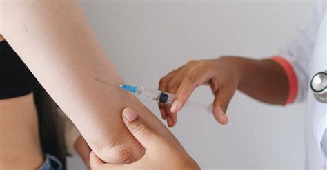 person injecting  patient  stock photo
