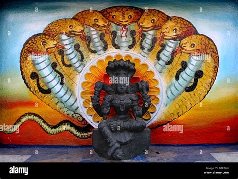 Temple statue and mural of Nagini the female snake goddess , India ...