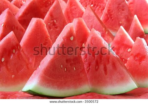 background brightly lit watermelon slices stock photo