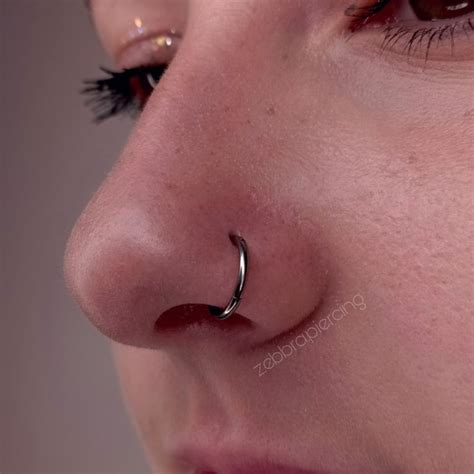 Healed nostril piercing with titanium clicker ring | Пирсинг носа ...