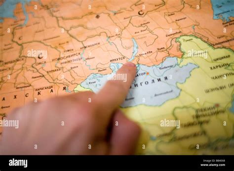 A person points to Olkhon Island on a Russian map in Olkhon Island ...