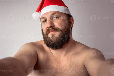Bearded half-naked Santa Claus man 2611787 Stock Photo at Vecteezy