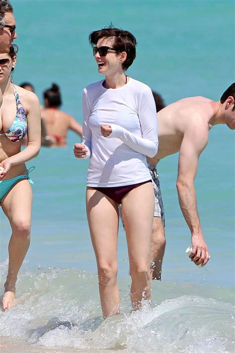 Anne Hathaway in a Covered Bikini, Beach in Miami - March 2014 • CelebMafia
