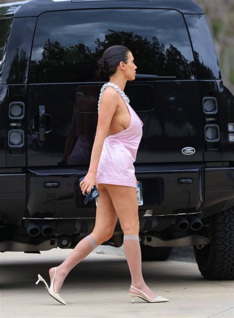 Bianca Censori suffers a wardrobe malfunction in tiny pink mini dress