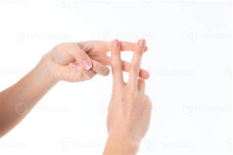 female hand  crossed fingers    isolated