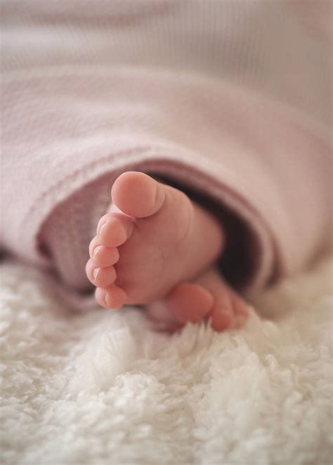 Download Cute Tiny Baby Feet On Wool Wallpaper | Wallpapers.com
