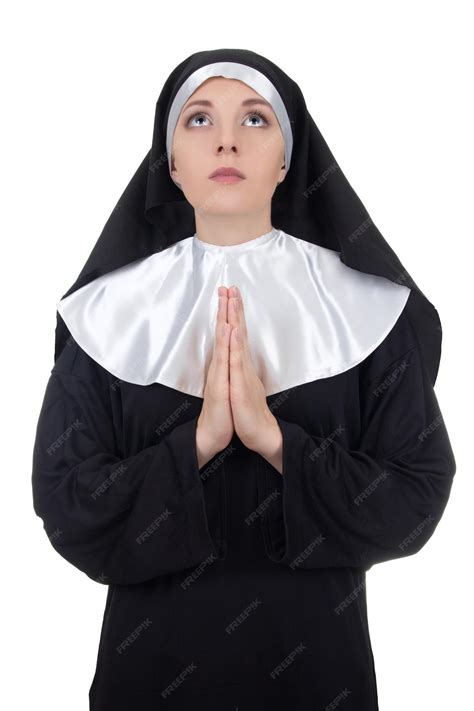 Premium Photo | Portrait of young beautiful woman nun praying isolated