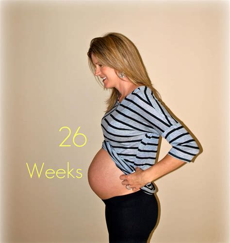 Download A Pregnant Woman With The Words 26 Weeks | Wallpapers.com