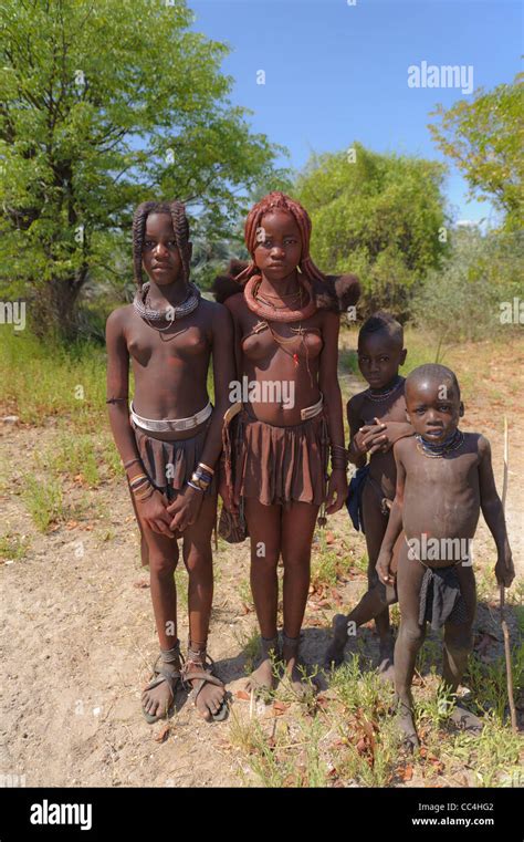 four Himba children posing for the camera. Kaokoland, Northern Namibia ...