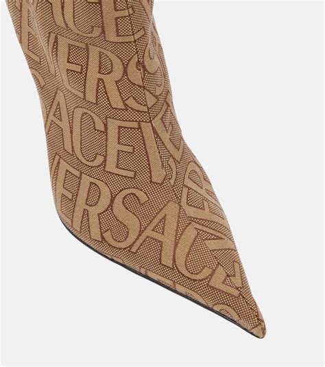 Versace Allover knee-high boots in brown - Versace | Mytheresa