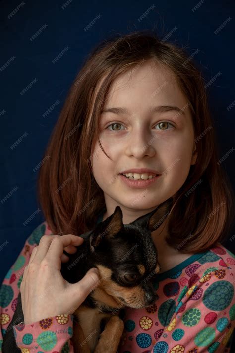 Premium Photo | Little girl with a chihuahua. girl holding chihuahua
