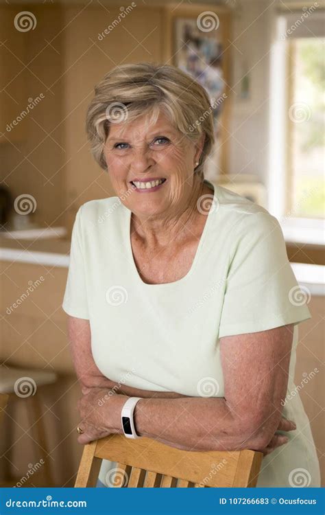 Sweet Senior Woman Looking Up At Copyspace Stock Photo | CartoonDealer