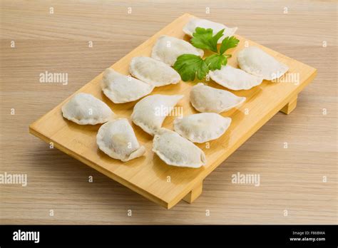 Raw Ukrainian vareniki on the board Stock Photo - Alamy