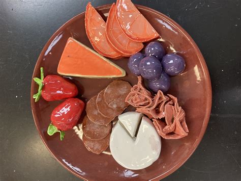 Delicious Food Display on a Brown Plate
