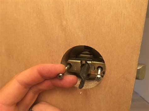 how to put doorknob on door