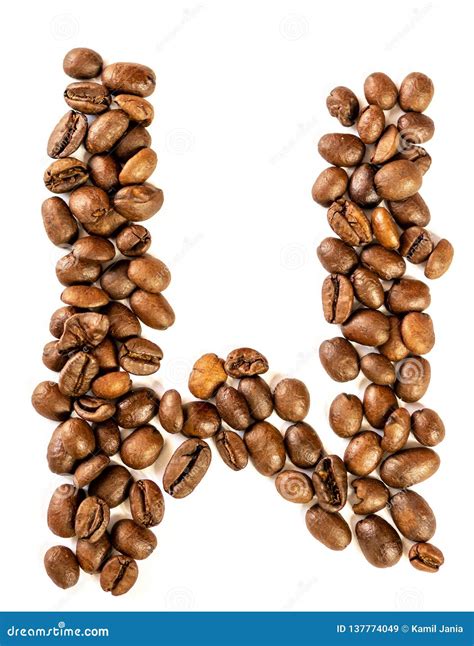 W Letter Made from Coffee Beans Isolated on White Background Stock