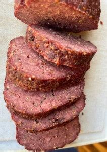 Venison Summer Sausage Recipe in the oven - A Ranch Mom