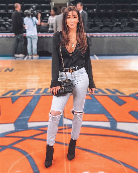 What To Wear To A Basketball Game Woman Wearing A Graphic Tee Is One