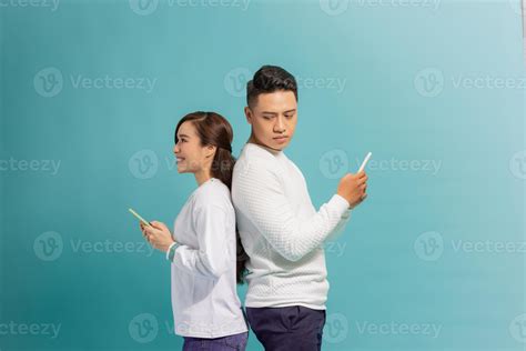 Distrust Concept. Jealous husband spying on wife while she using phone