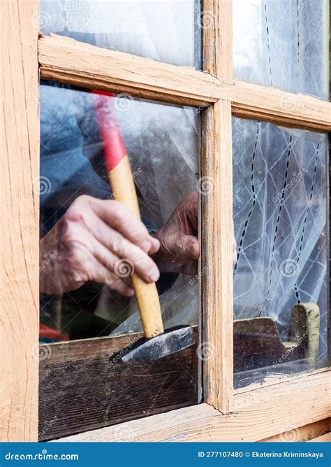 Installation Window Glass in Frame Using Hammer Stock Photo - Image of