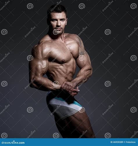 Bodybuilder Posing Stock Photo | CartoonDealer.com #46920642