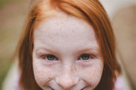 "Redheaded Girl With Blue Eyes" by Stocksy Contributor "Erin Drago ...