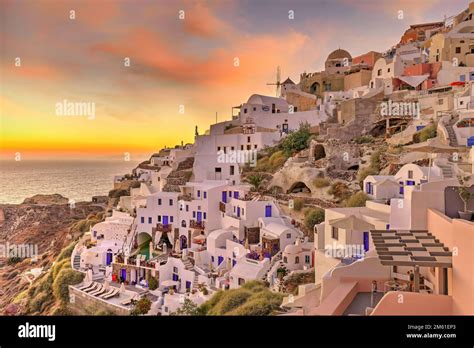 Oia windmills sunset hi-res stock photography and images - Alamy