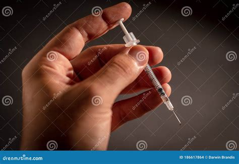 hand holding  syringe stock photo image  diabetes