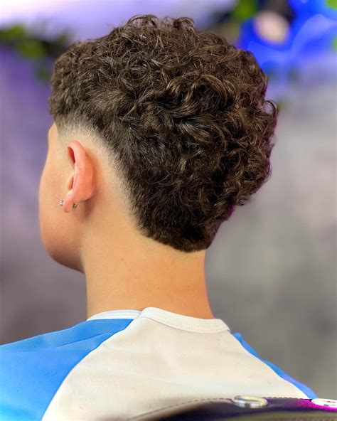 Taper fade curly hair styles are taking over modern barber shops 16