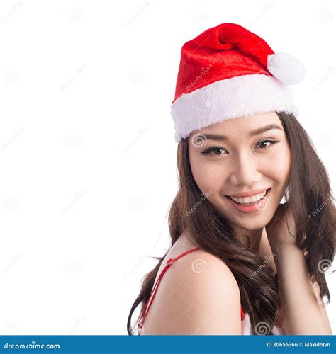 Christmas Woman. Beauty Asian Model Girl in Santa Hat Isolated O Stock